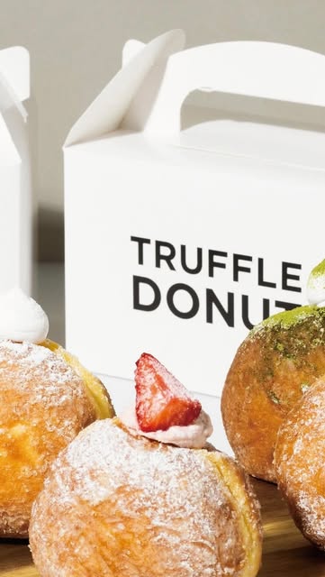 Powdered Truffle Donuts with strawberry, matcha, and cream toppings